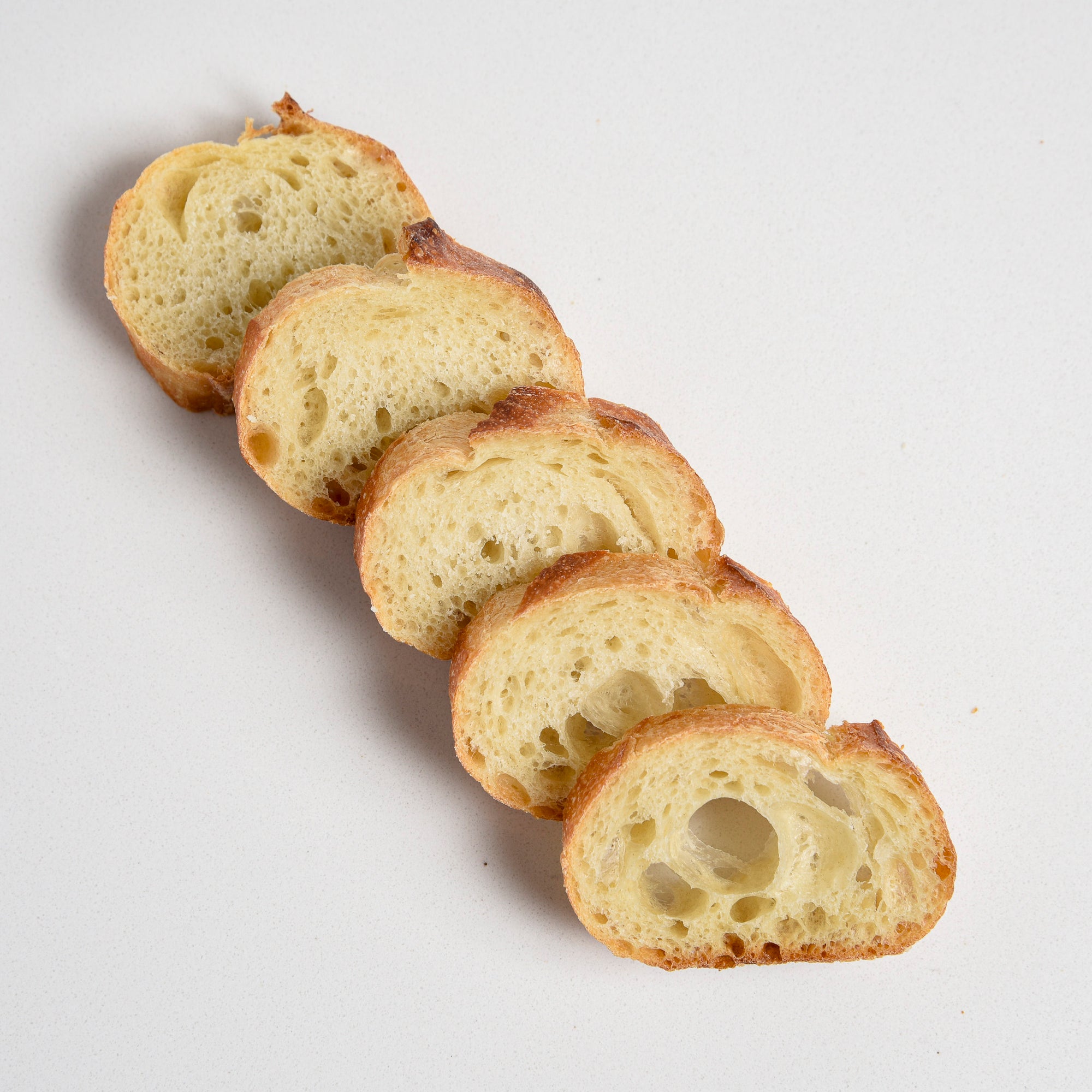 Le fournil bakery traditional French baguette sliced rounds