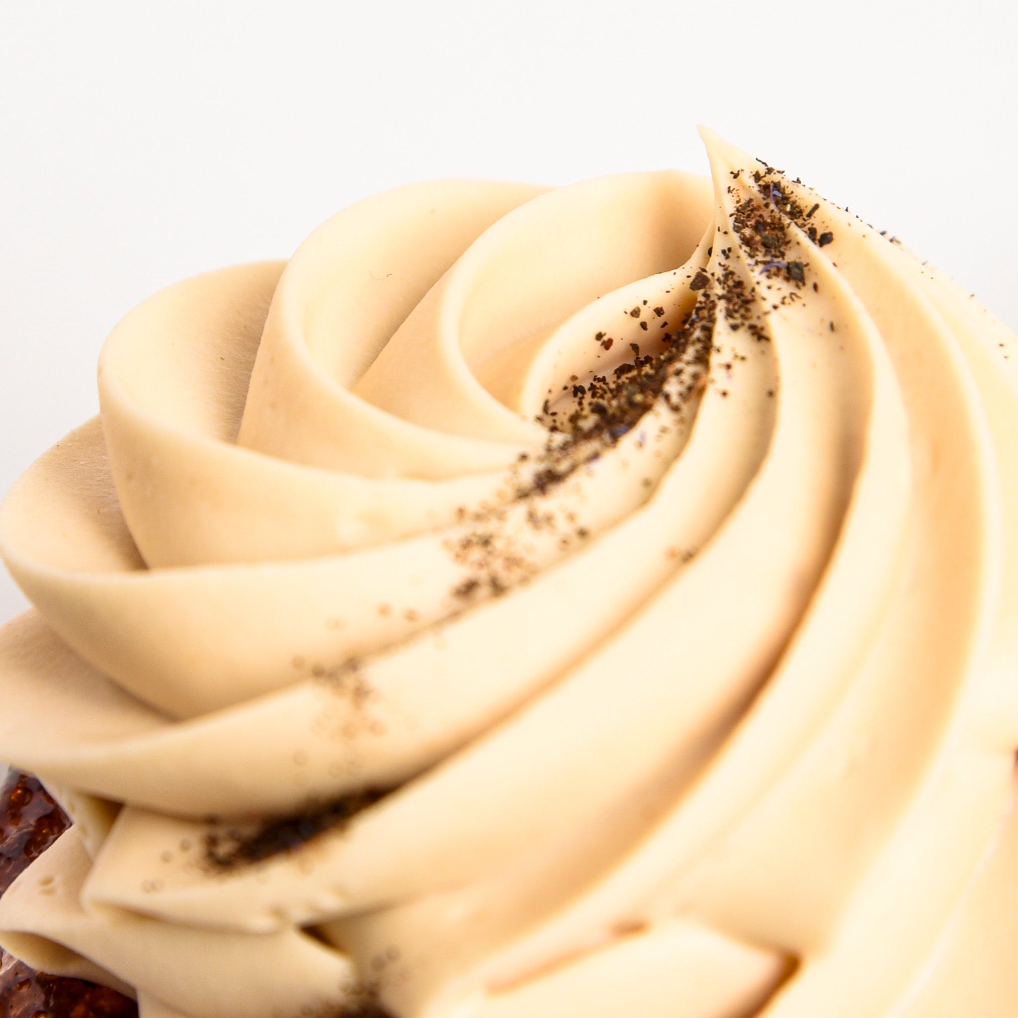 Earl Grey whipped ganache close up on Le fournil Bakery's orange cake.