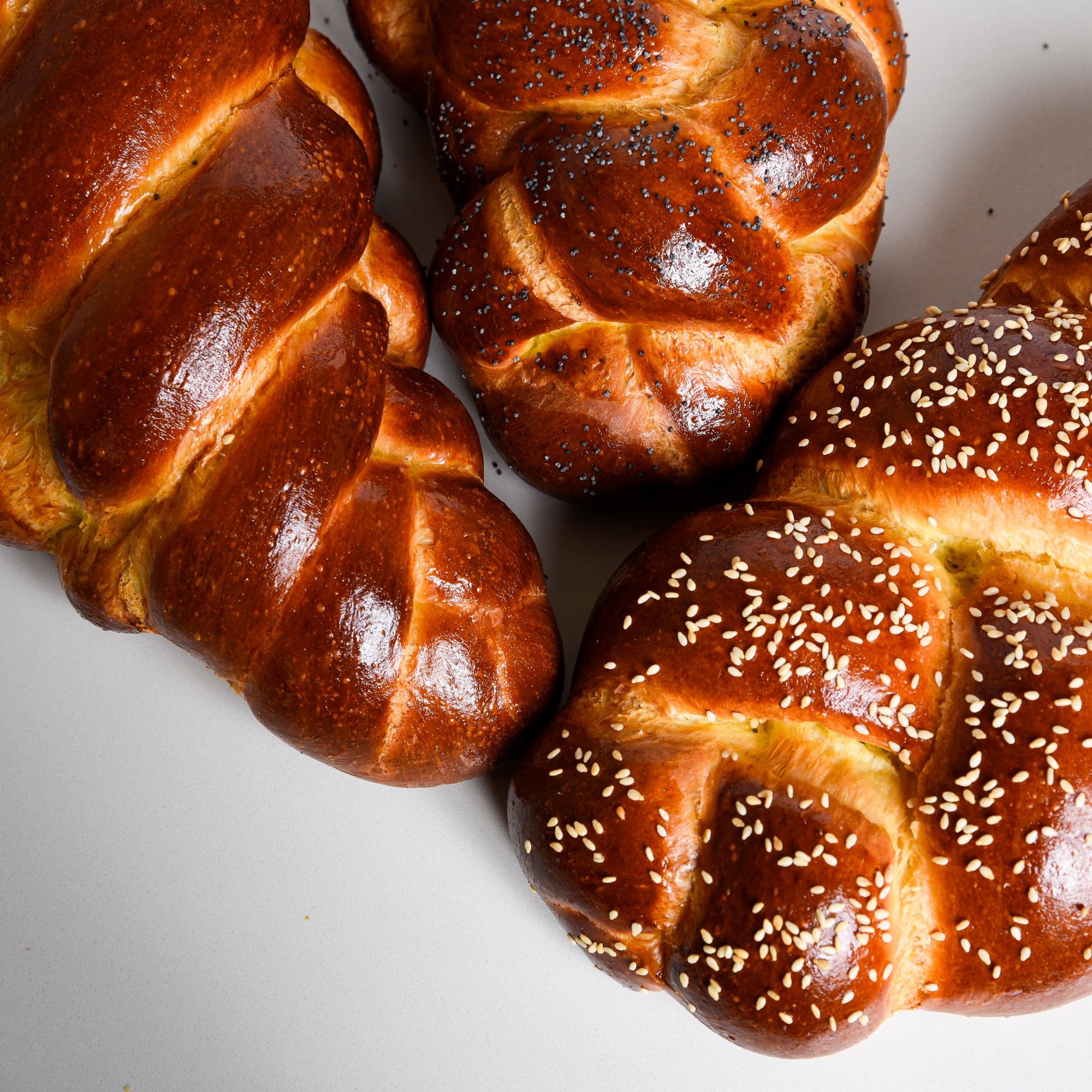Group of challah traditional enriched breads by Le forunil bakery