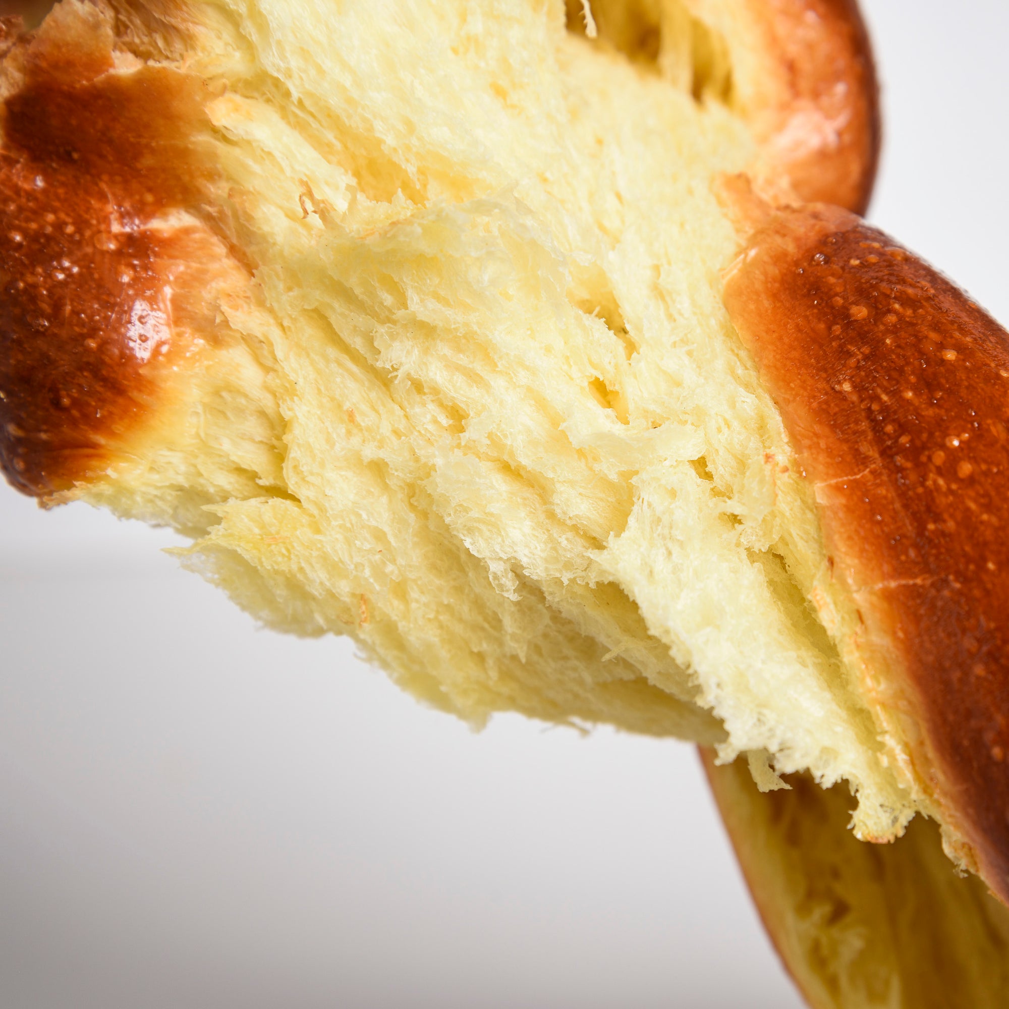 Tearing Le fournil challah traditional bread