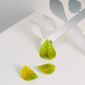 Colourful Spring Chocolate Leaves Next to Comb