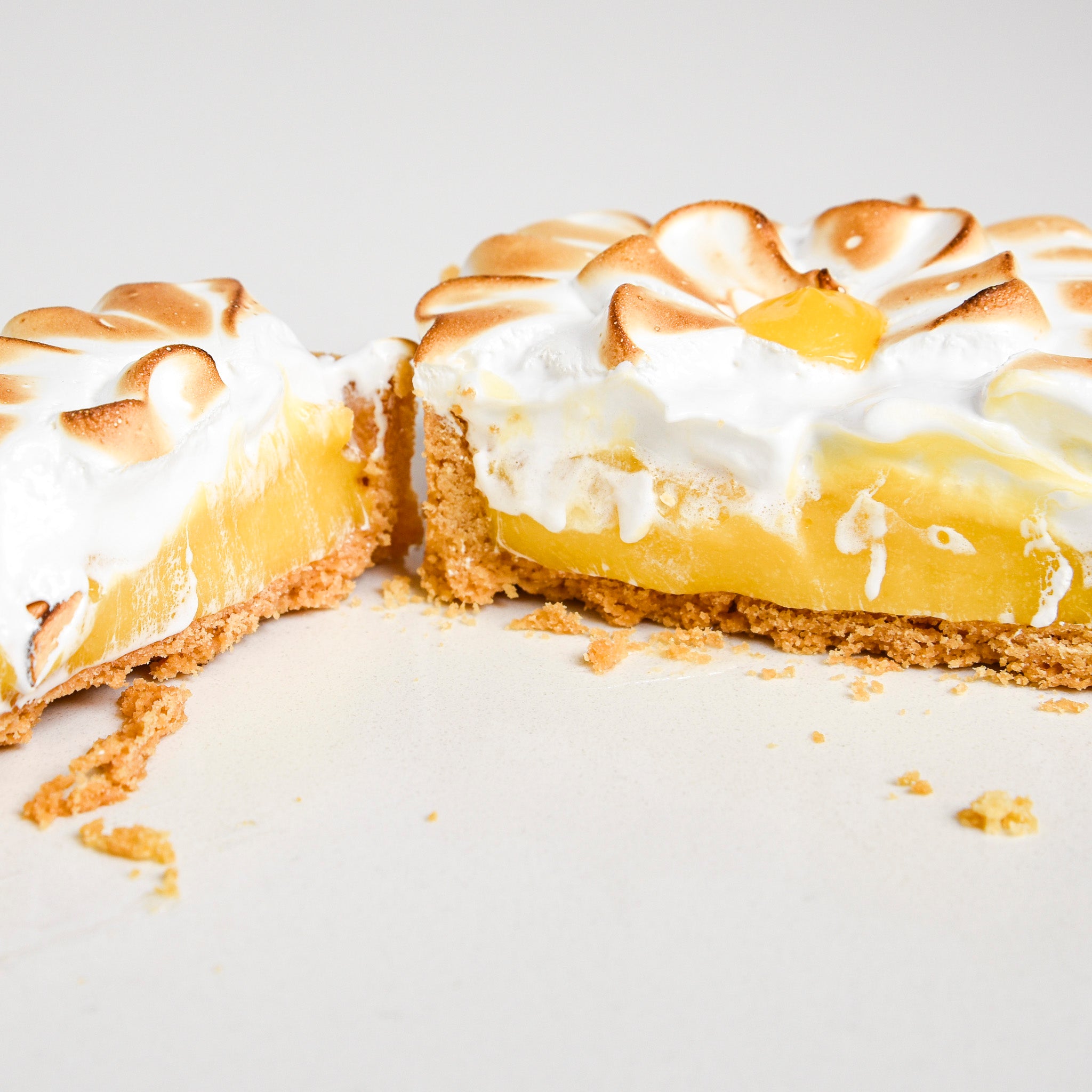 Close up of Le fournil bakery tartelette citron-meringue classic lemon meringue tart with fresh curd